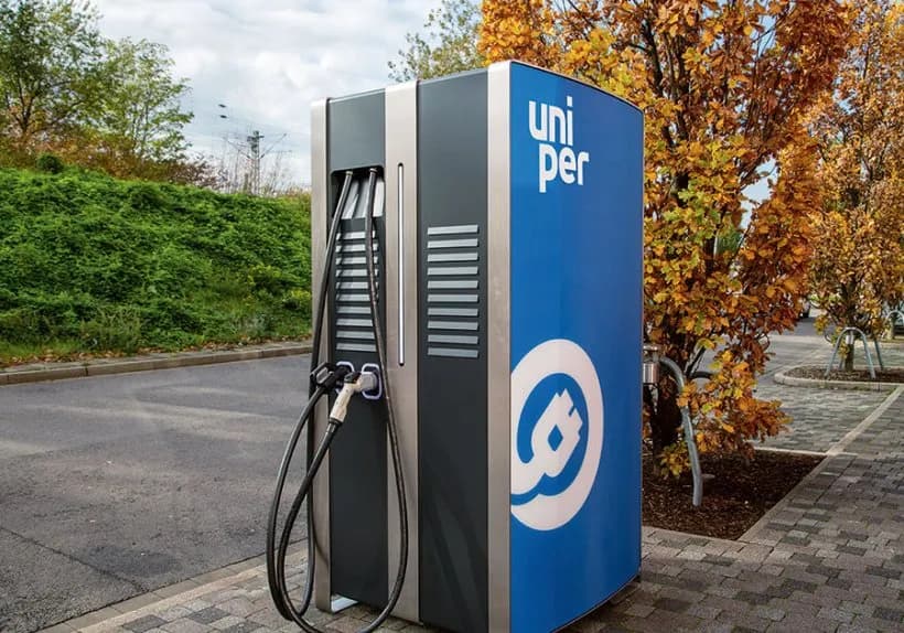 Uniper-branded electric vehicle fast-charging station with multiple charging cables, installed in a paved outdoor area.